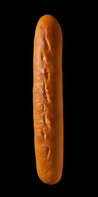 Fresh classic hot dog bun isolated on black background