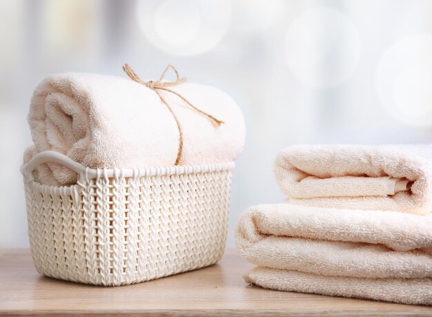 Fresh clean towels on wooden table