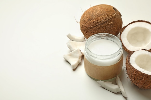 Fresh coconut and coconut milk on white background