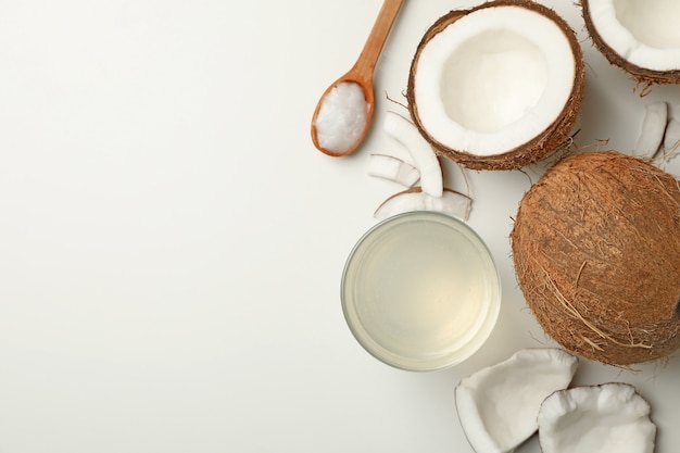 Fresh coconut and coconut milk on white background