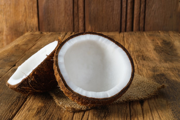 Fresh coconuts on old wooden background