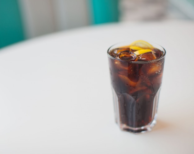 fresh cola drink on a white table into a american dinner restaurant