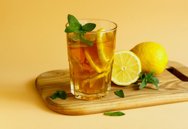 Fresh and cold ice tea with lemon and mint