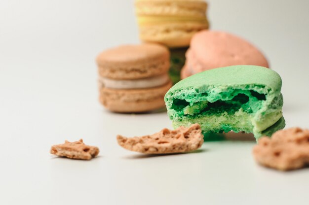 Fresh colored macaroons on white background