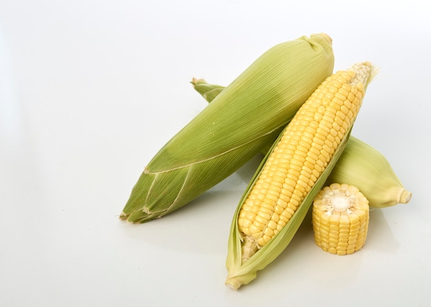 Fresh corn on white table background, closeup