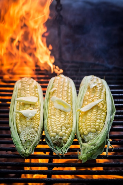 Fresh corn with butter and salt on grill