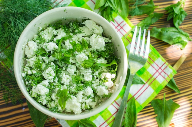 Fresh cottage cheese with spinach and herbs