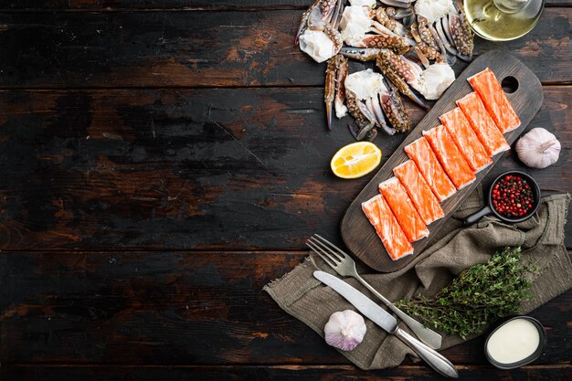 Fresh Crab meat stick surimi  set, on dark wooden background, top view flat lay , with copyspace  and space for text