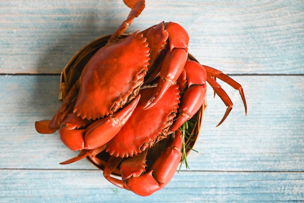 Fresh crab on wooden steamer and herbs spices seafood crab cooking food steamed crab red in the seafood restaurant kitchen