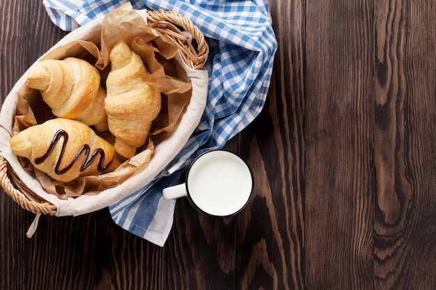 Fresh croissants basket and milk