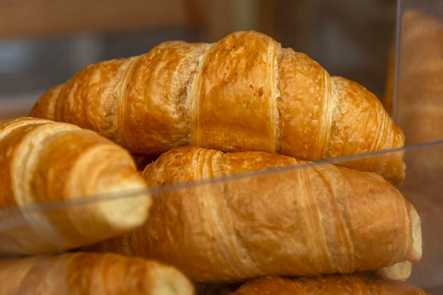 Fresh croissants on the counter Traditional pastries for breakfast and coffee Closeup