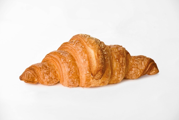 Fresh croissants on white surface