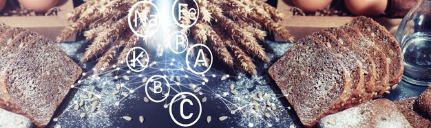 Fresh crunchy cookie with wheat and gluten on a black table. Bakery and grocery concept. Fresh, healthy sorts of rye and white cookies on sackcloth with milk.