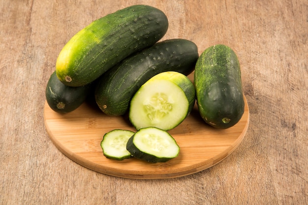 Fresh cucumber on the wooden table. Fresh vegetable.