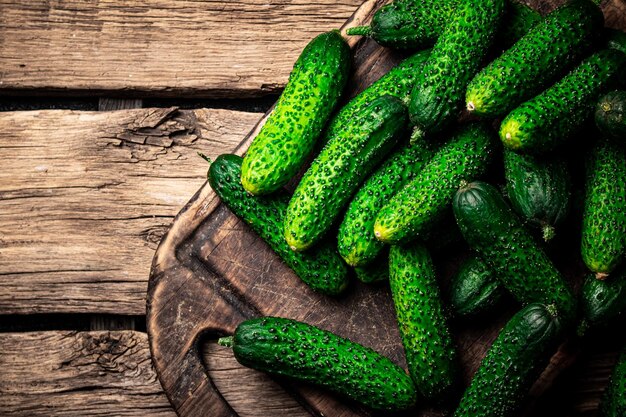 Fresh cucumbers on a cutting board