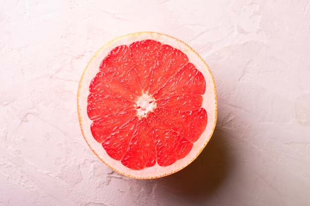 Fresh cut grapefruit on a white table