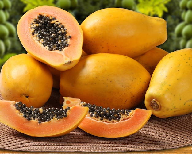 Fresh cut juicy tropical papaya mamao fruit with seeds at Brazilian. Fresh fruits