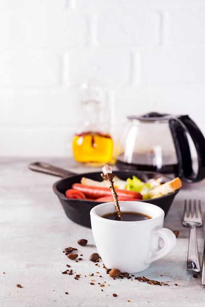 Fresh delicious breakfast with soft boiled egg, crispy toasts and cup coffee