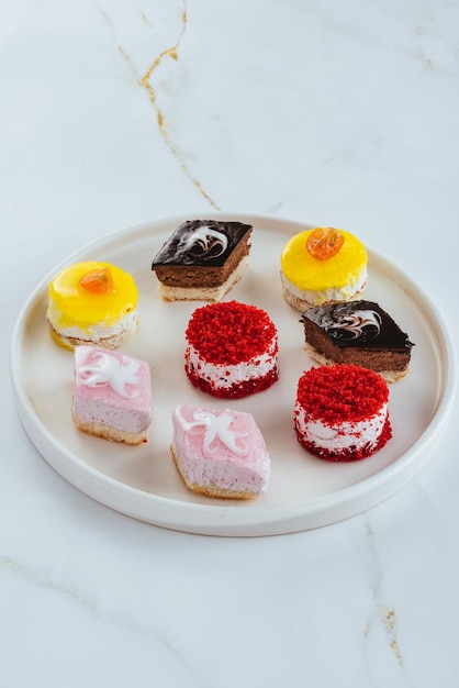 Fresh delicious desserts on a light background