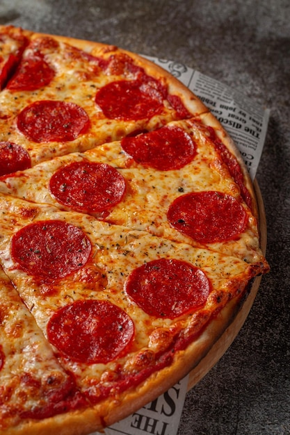 Fresh delicious Italian pizza on a gray stone table background