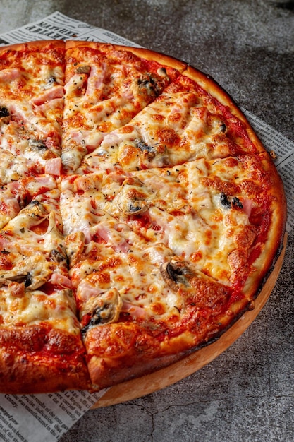 Fresh delicious Italian pizza on a gray stone table background