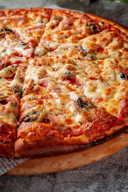 Fresh delicious Italian pizza on a gray stone table background