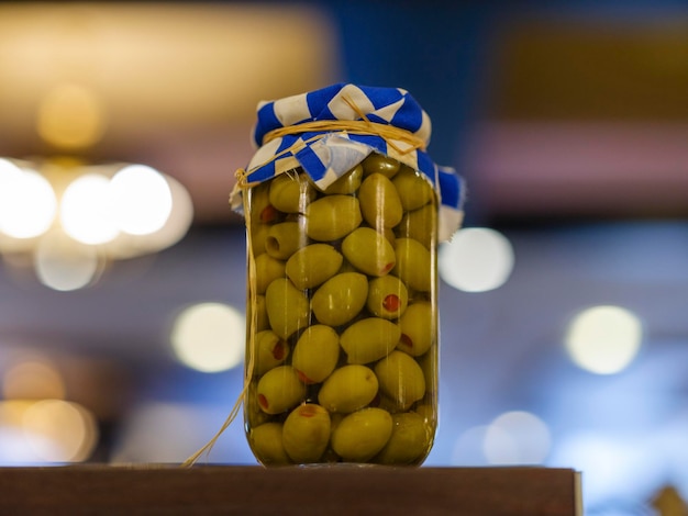 Fresh and delicious olives in glass jar