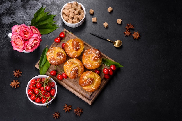 Fresh delicious rice flour muffins with cherries on a concrete background Homemade pastries