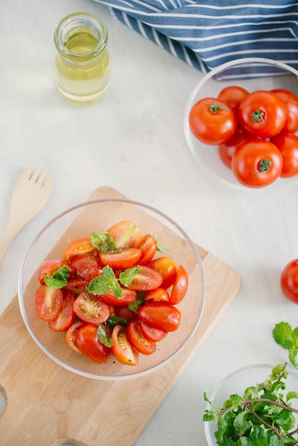 Fresh delicious salad with tomatoes Doing fresh green salad