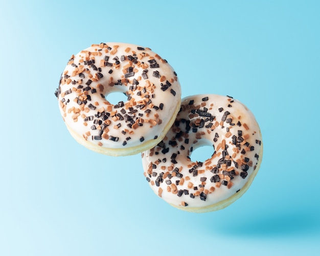 Fresh donuts on blue background