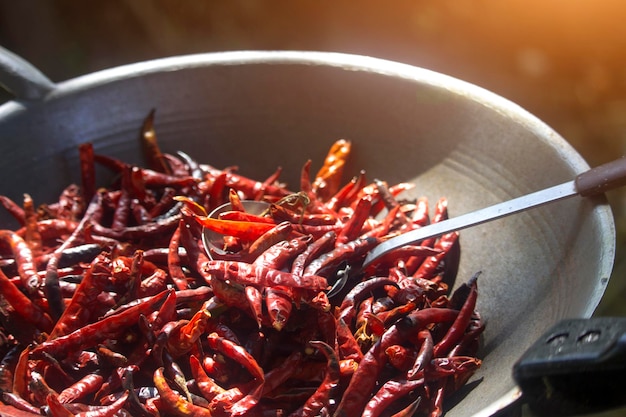 Fresh dried chilies in the pan to roast