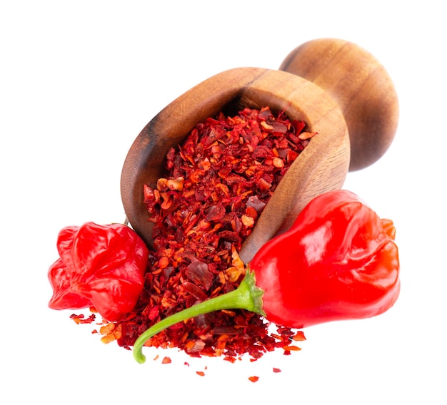 Fresh and dry ground red chili peppers isolated on white background Capsicum baccatum or Bishop's crown pepper