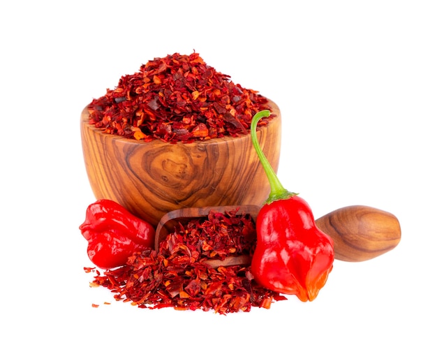 Fresh and dry ground red chili peppers isolated on white background Capsicum baccatum or Bishop's crown pepper