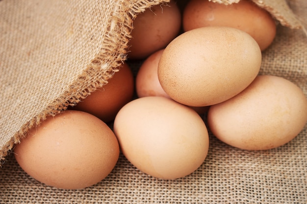 Fresh eggs on wooden background