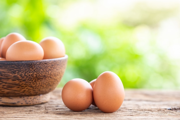 Fresh eggs on wooden table for food concept