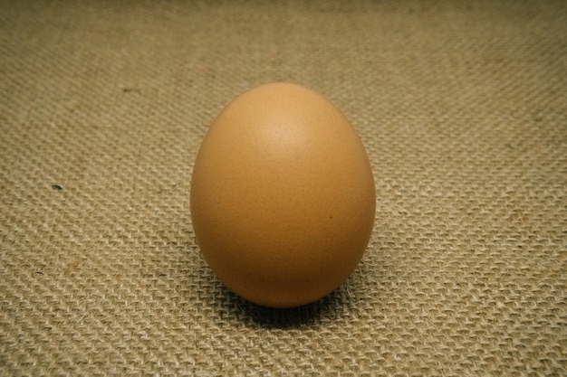 Fresh farm eggs on a wooden rustic background