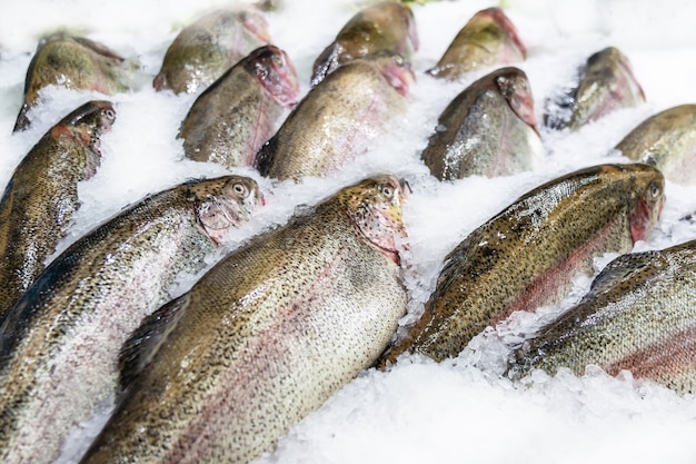 Fresh fish on ice decorated for sale at market, pink salmon