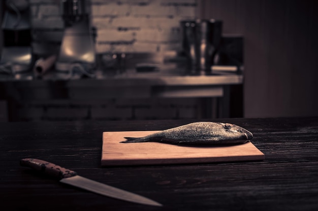 Fresh fish on a wooden cutting board