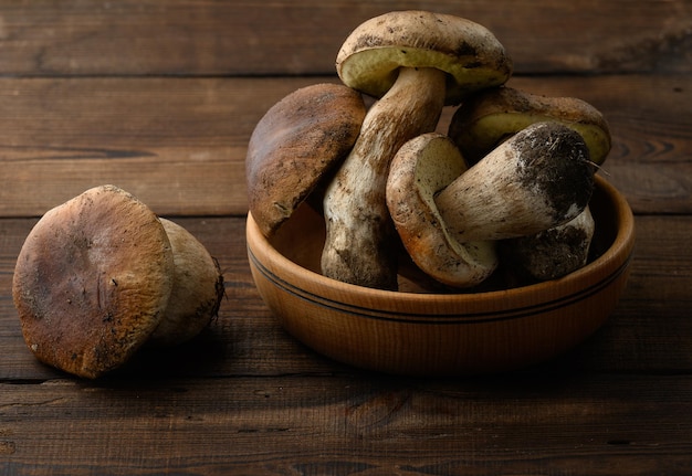 Fresh forest porcini mushrooms in a wooden