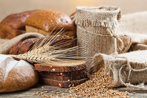 Fresh fragrant baked bread on an old background