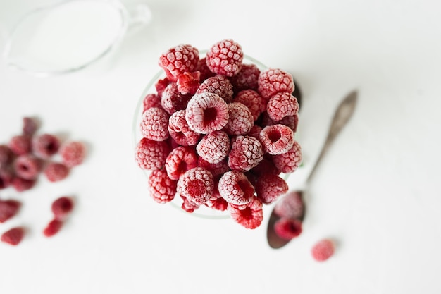 Fresh frozen red beautiful raspberries summer menu snacks in hot weather seasonal ripe berry