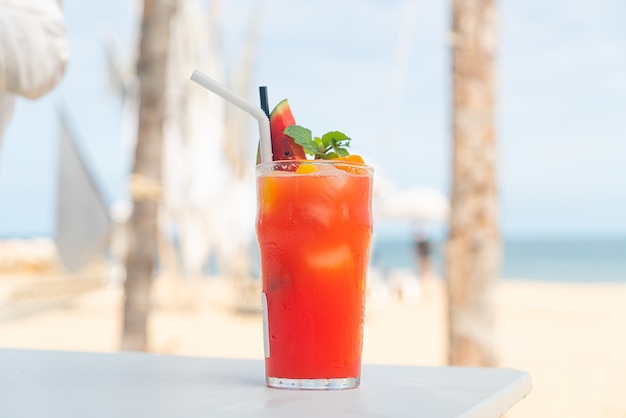 fresh fruit punch with sea beach background