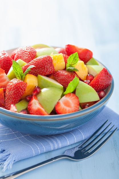 Fresh fruit salad with strawberry, apple, nectarine, pomegranate