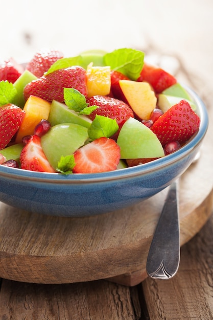 Fresh fruit salad with strawberry, apple, nectarine, pomegranate