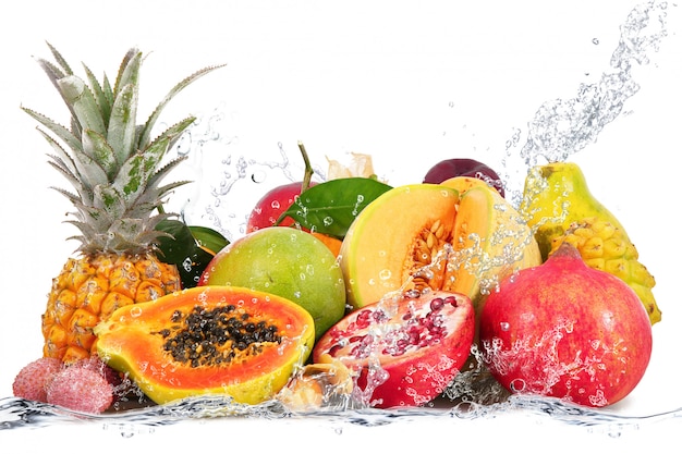 Fresh fruits falling in water