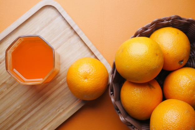 Fresh fruits and orange juice on table