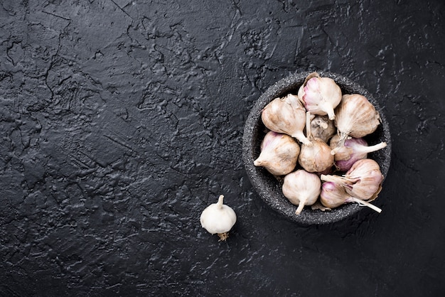 Fresh garlic on black  background