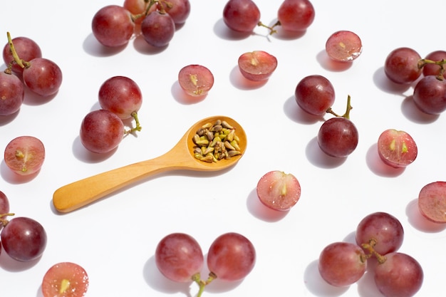 Fresh grape with seeds on white background.