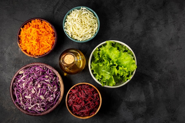 Fresh grated vegetables in bowls on the table Healthy food