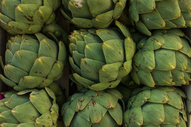 Fresh green artichokes in box